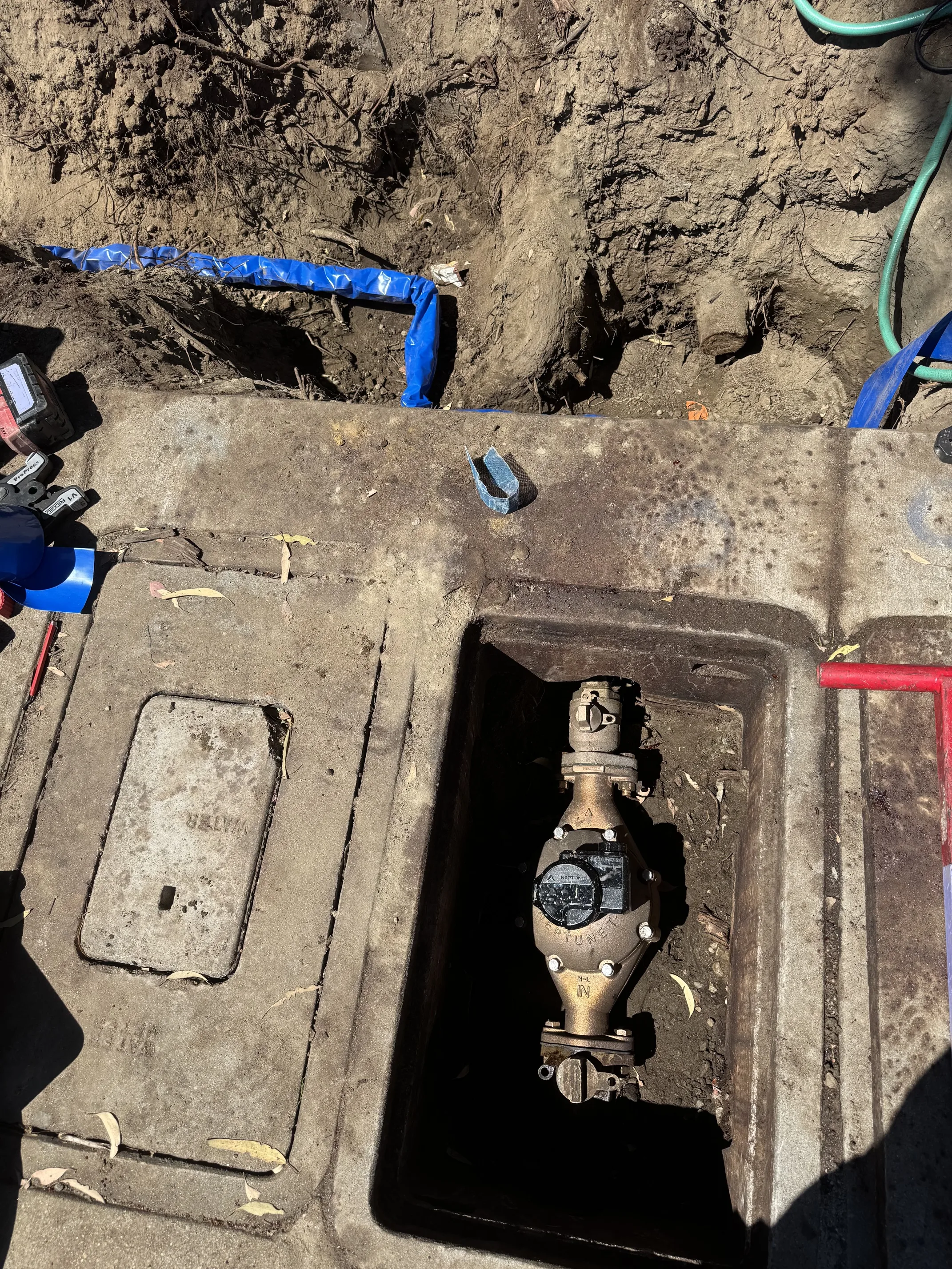 Water meter box with backflow preventer valve and shutoff