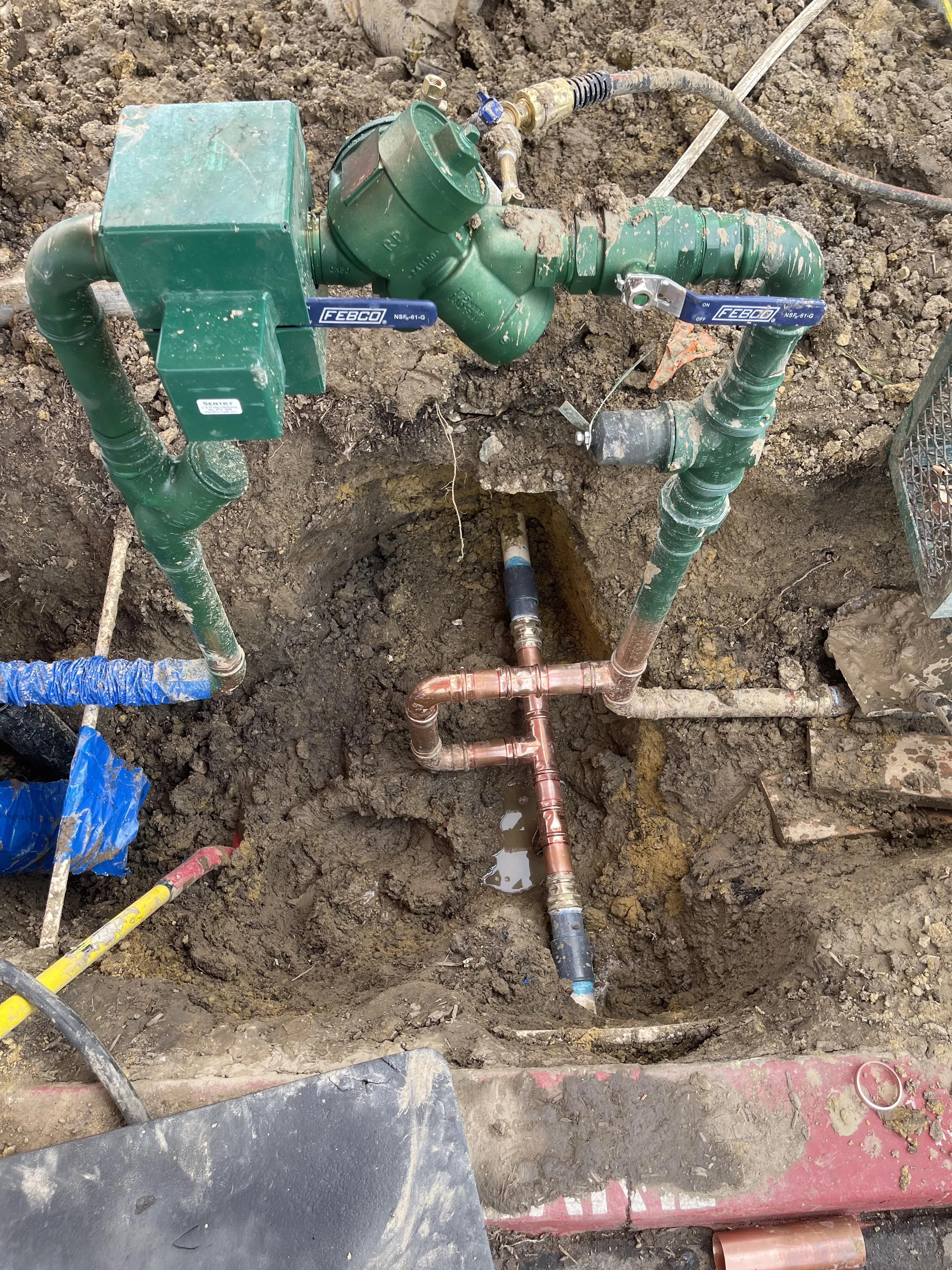 Underground valve access during commercial plumbing assessment